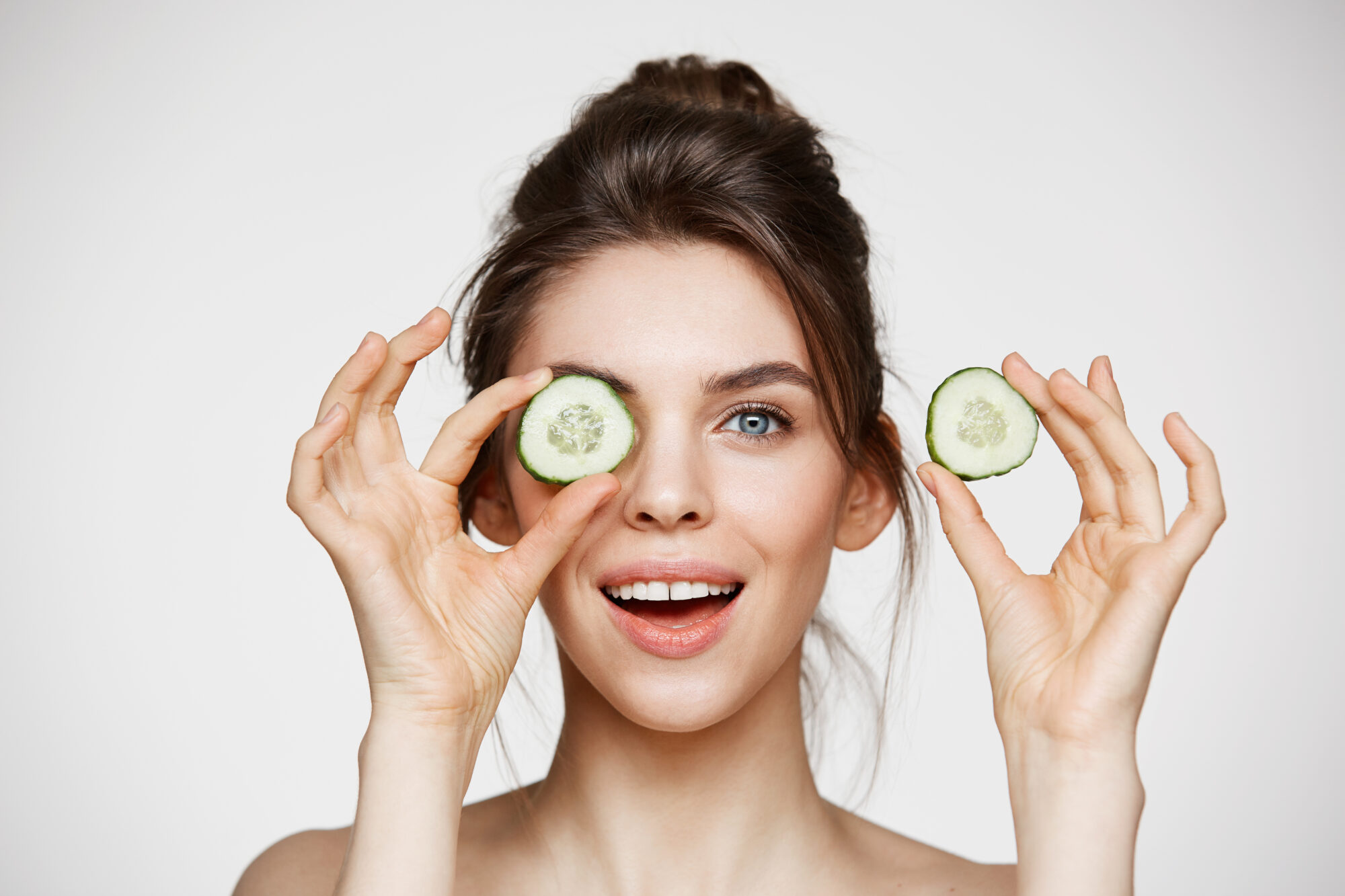 woman with cucumber slices